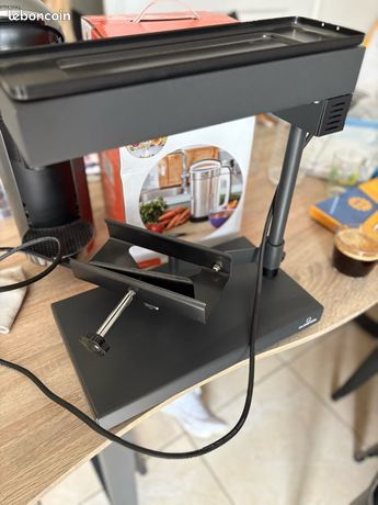 Appareil à raclette pour meule