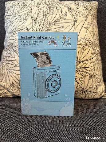 Appareil photo avec imprimante intégré
