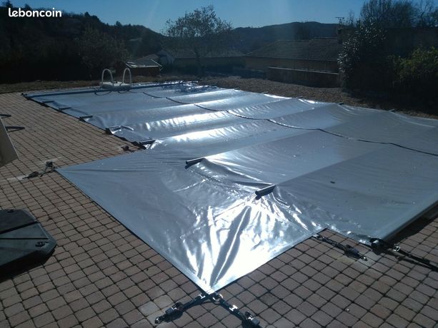 Bâche à barre pour piscine Desjoyaux avec bloc filtrant