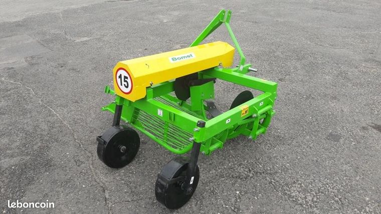 Bomet Arracheuse vibrante à rejet sur les côtés