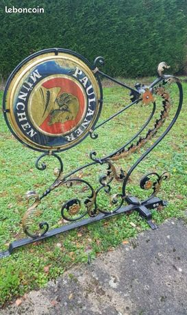 Enseigne commerce en fer forgé