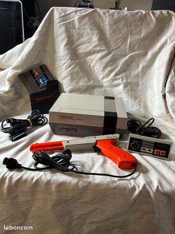 Nintendo NES +1 manette + jeux mario bros / duck hunt + zapper