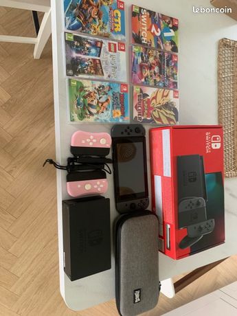 Nintendo Switch + 6 jeux + manettes + accessoires très bon état