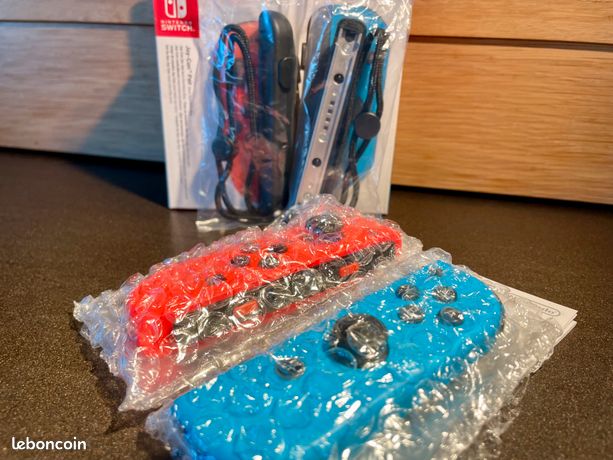 Nintendo Switch | Paire de manettes Joy-Con Bleu/Rouge Néon
