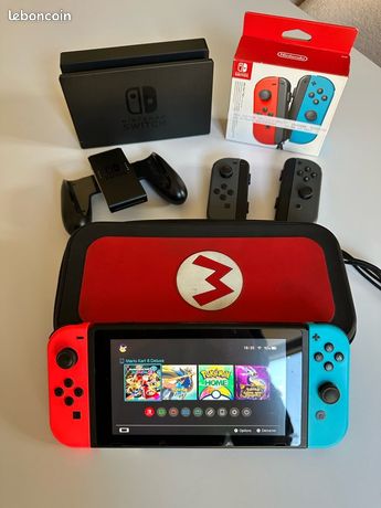 Nintendo Switch + 2 paires Joy-Cons + chargeur + dock + housse de transport