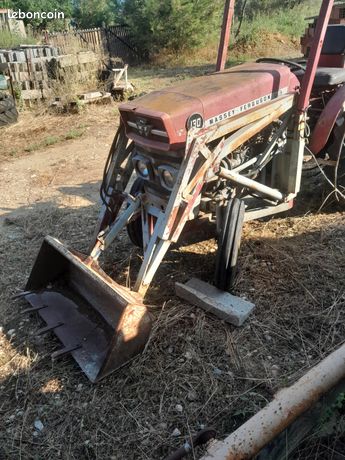 Tracteur MF 130 avec pelle avant et arrière