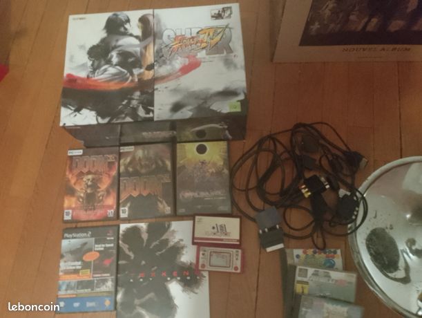Vds Rouen Lot de jeux vidéos Game and Watch OST shin megami tensei PS2 Tekken 6 art book Doom 3 pc Stick Arcade Tournament édition Etc